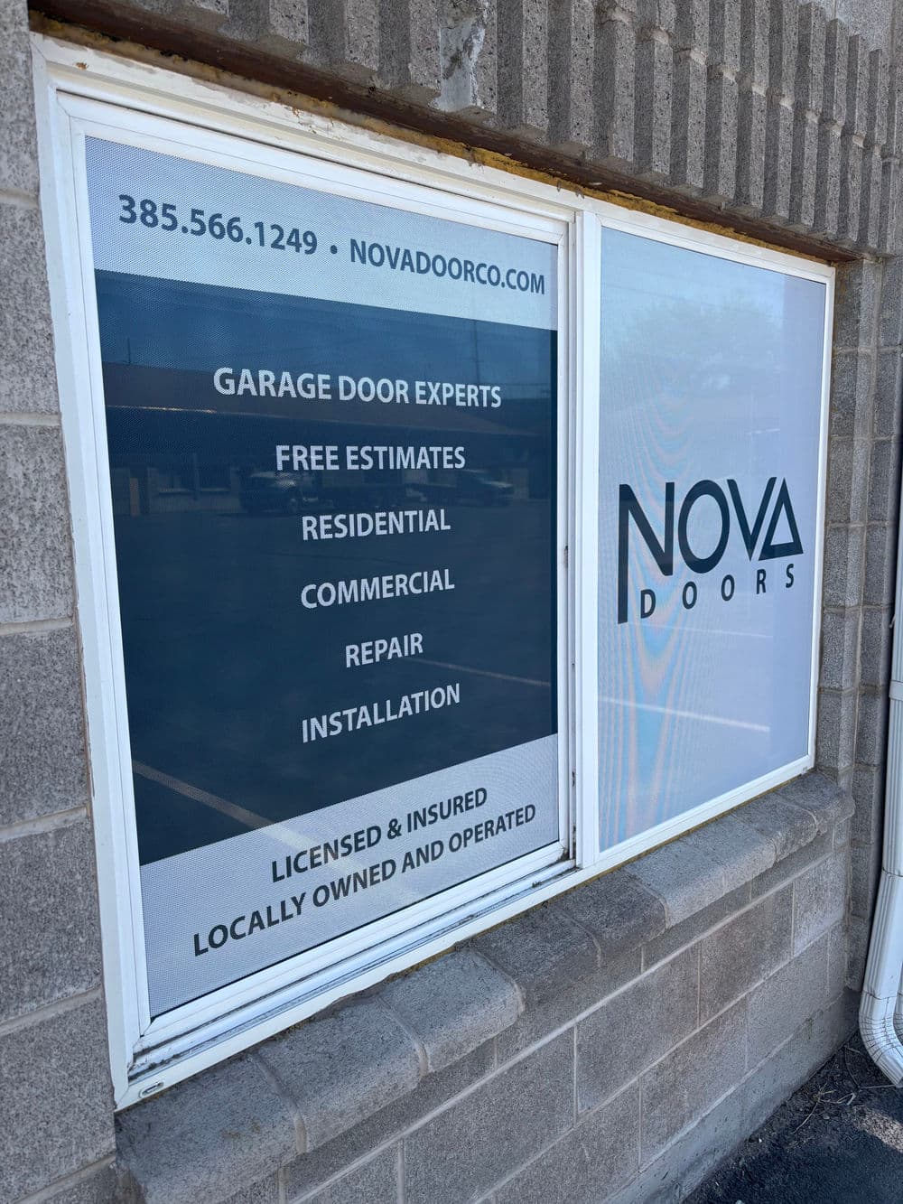 Nova Doors sign with services: garage door installation, repair, estimates for residential and commercial.